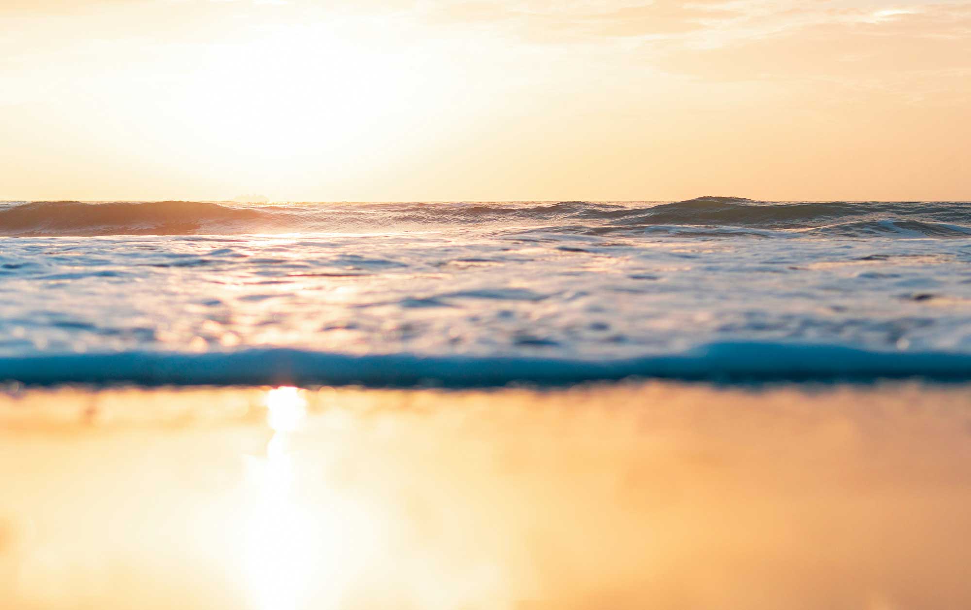 waves-on-golden-beach-at-sunset