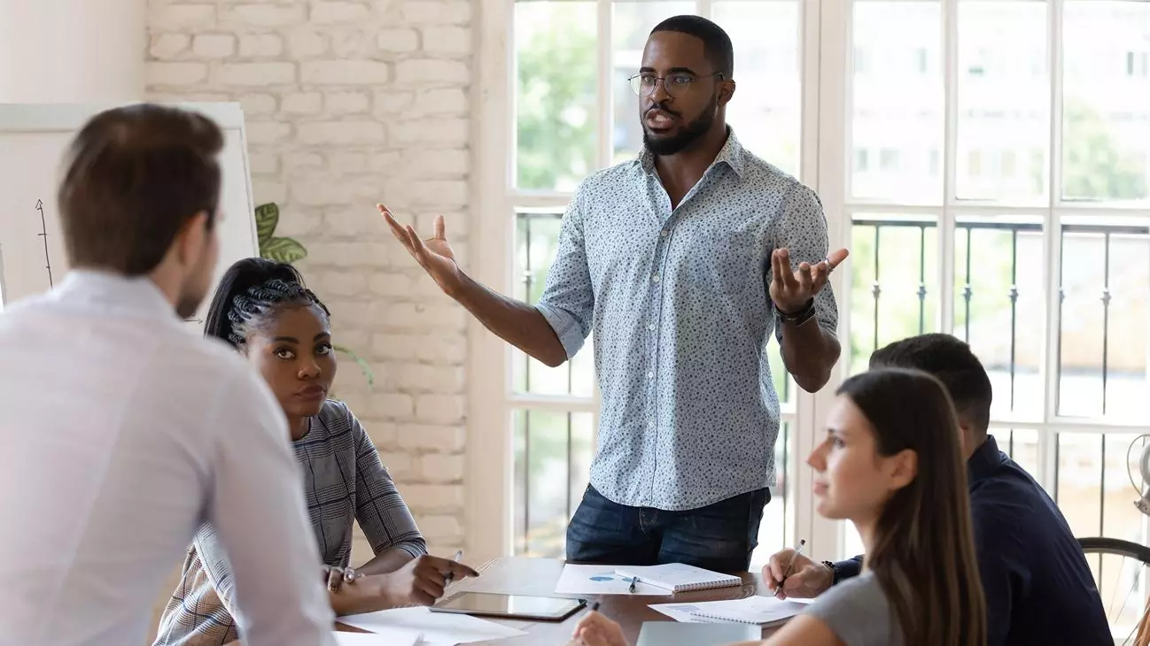 A man having discussion and presentation with his team