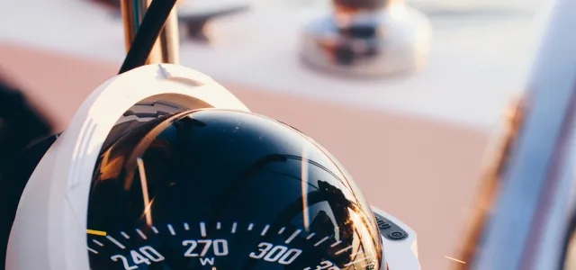 white and black compass pointing at 0 shallow focus photography by Ian Keefe courtesy of Unsplash.